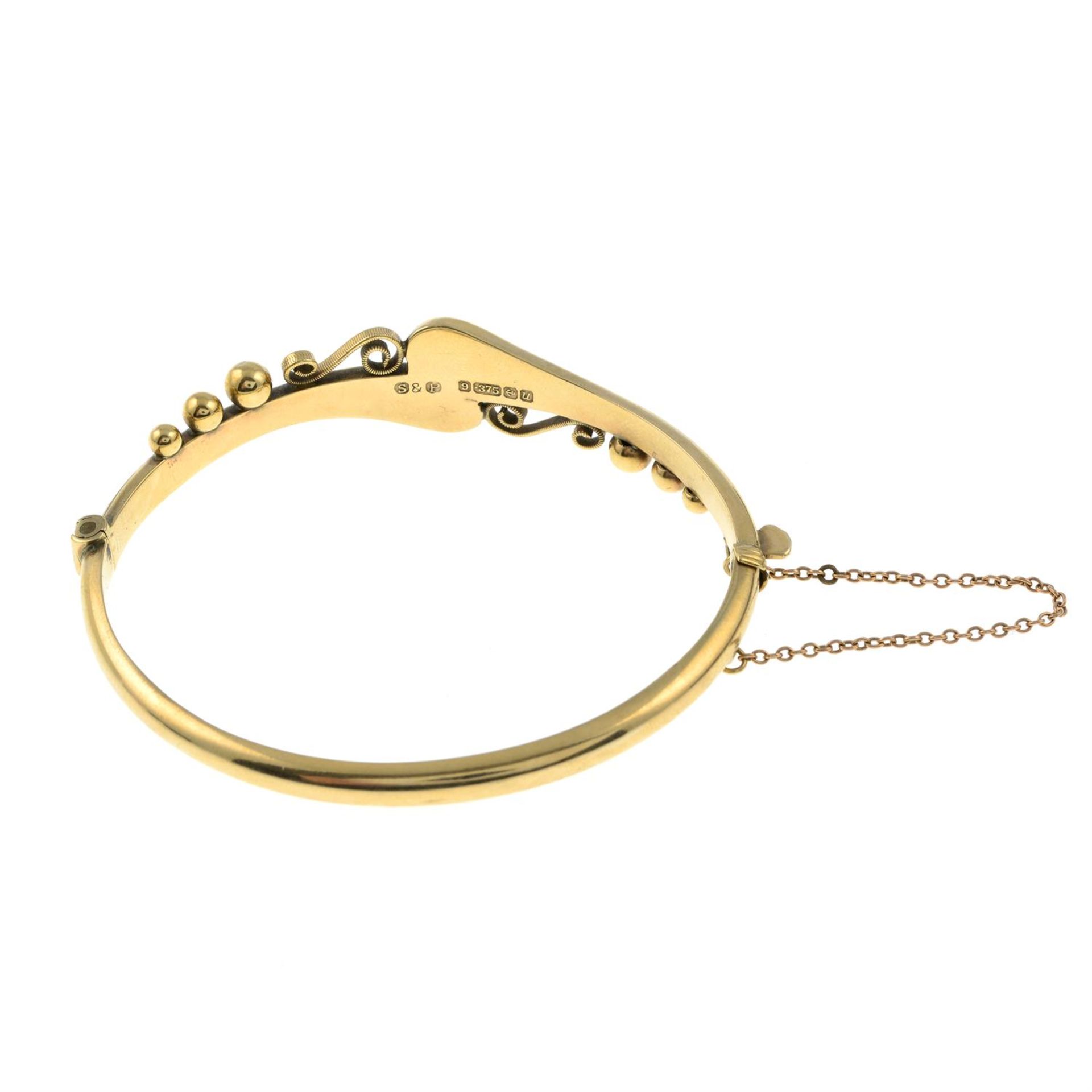 A 9ct gold hinged bangle. - Image 2 of 2