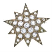 A late Victorian silver paste star brooch.
