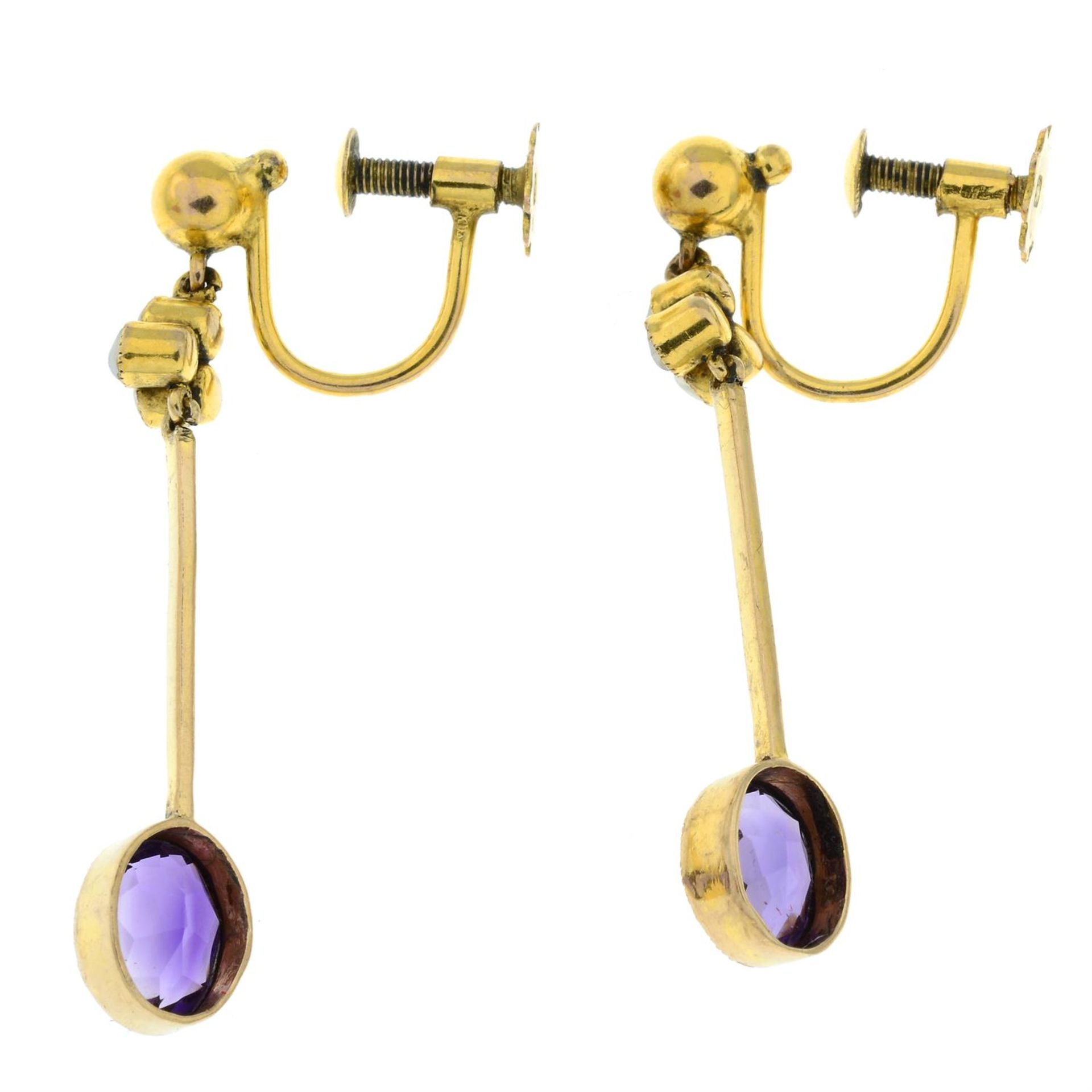 A pair of early 20th century 9ct gold amethyst and split pearl earrings. - Image 2 of 2