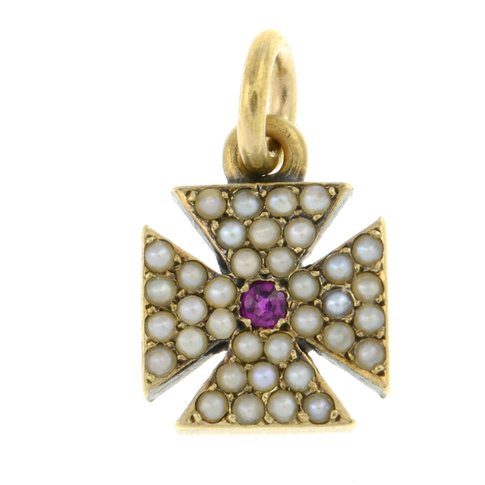 A late 19th century gold split pearl and ruby Maltese cross pendant/ charm.