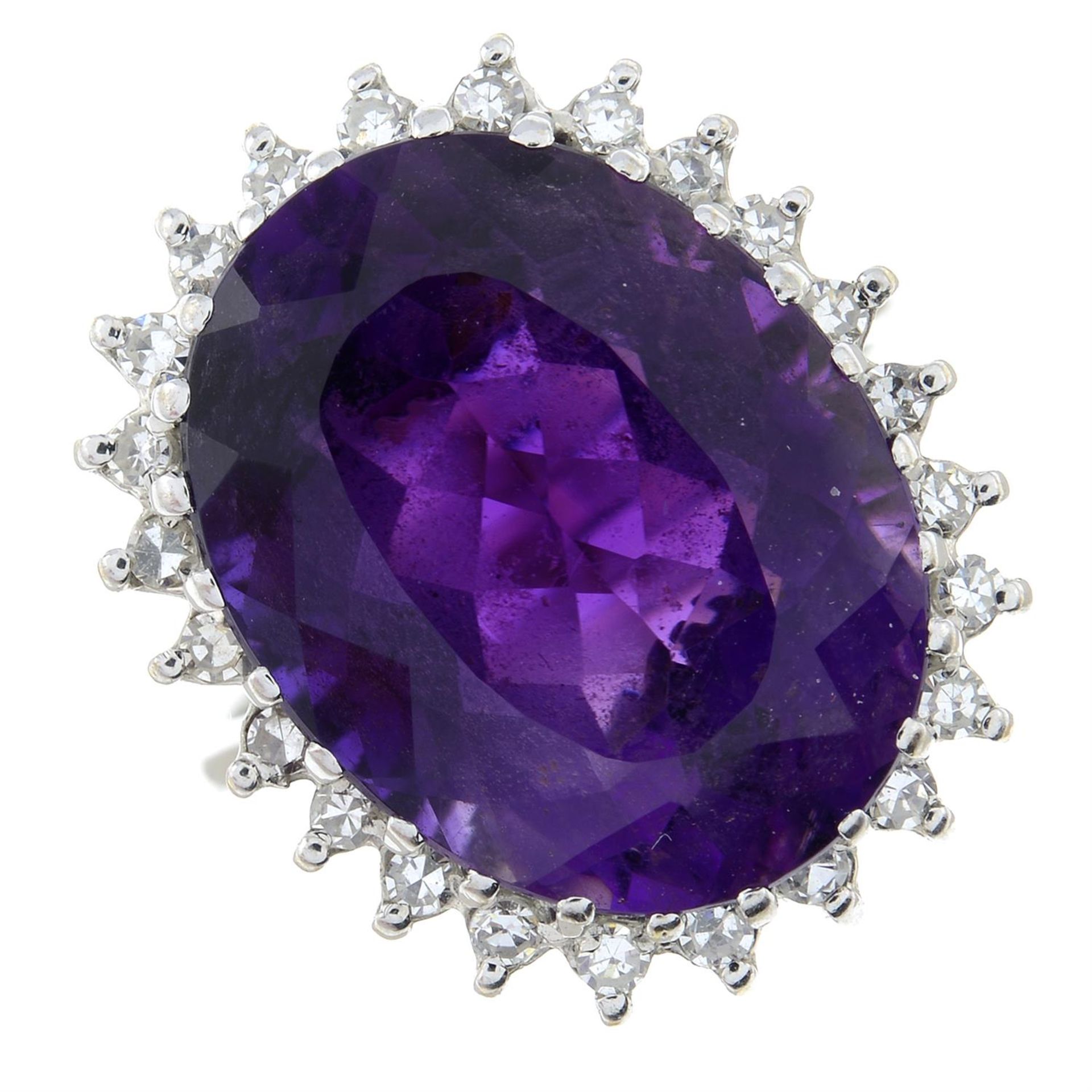 An amethyst and diamond cluster ring.