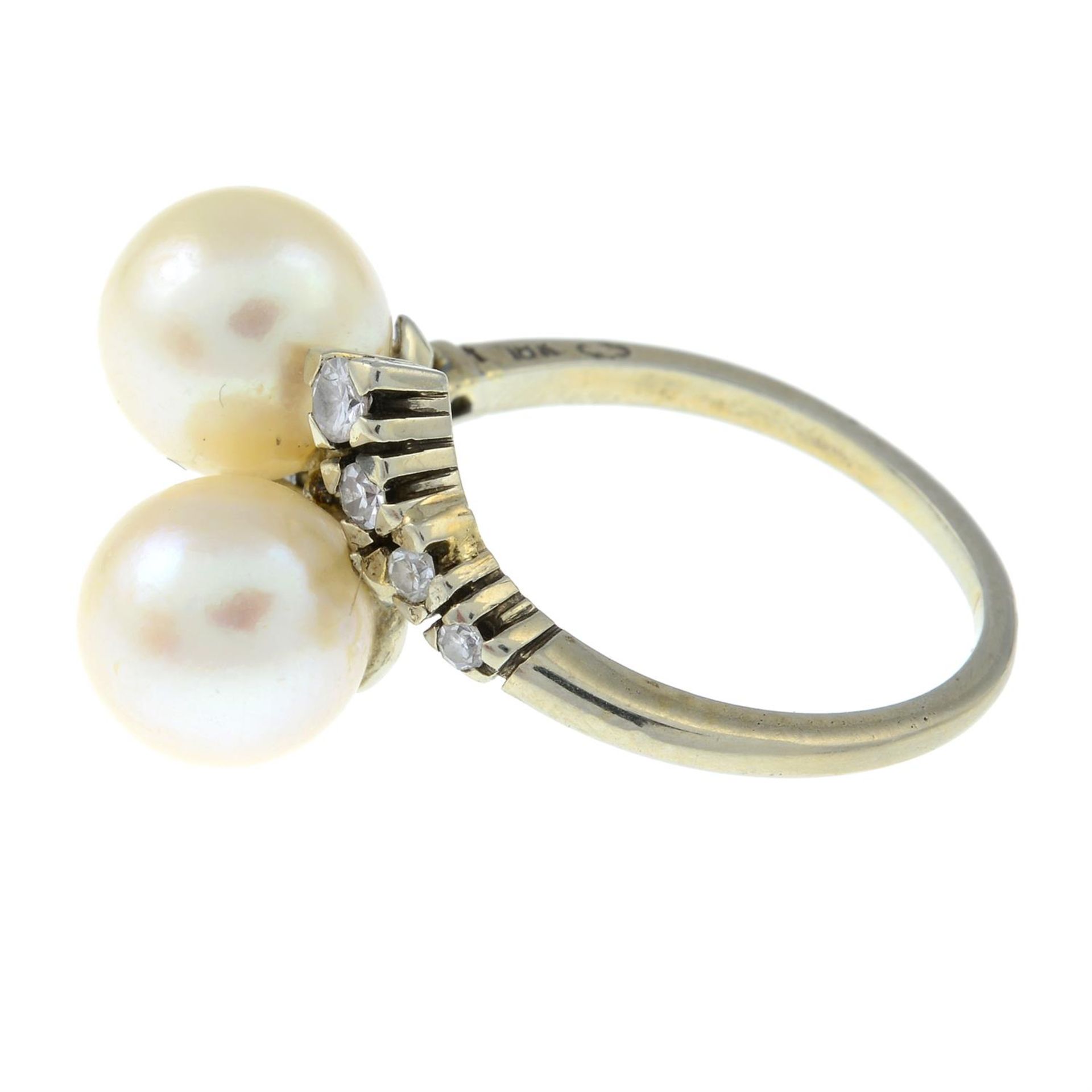 A cultured pearl and diamond crossover ring. - Image 2 of 3