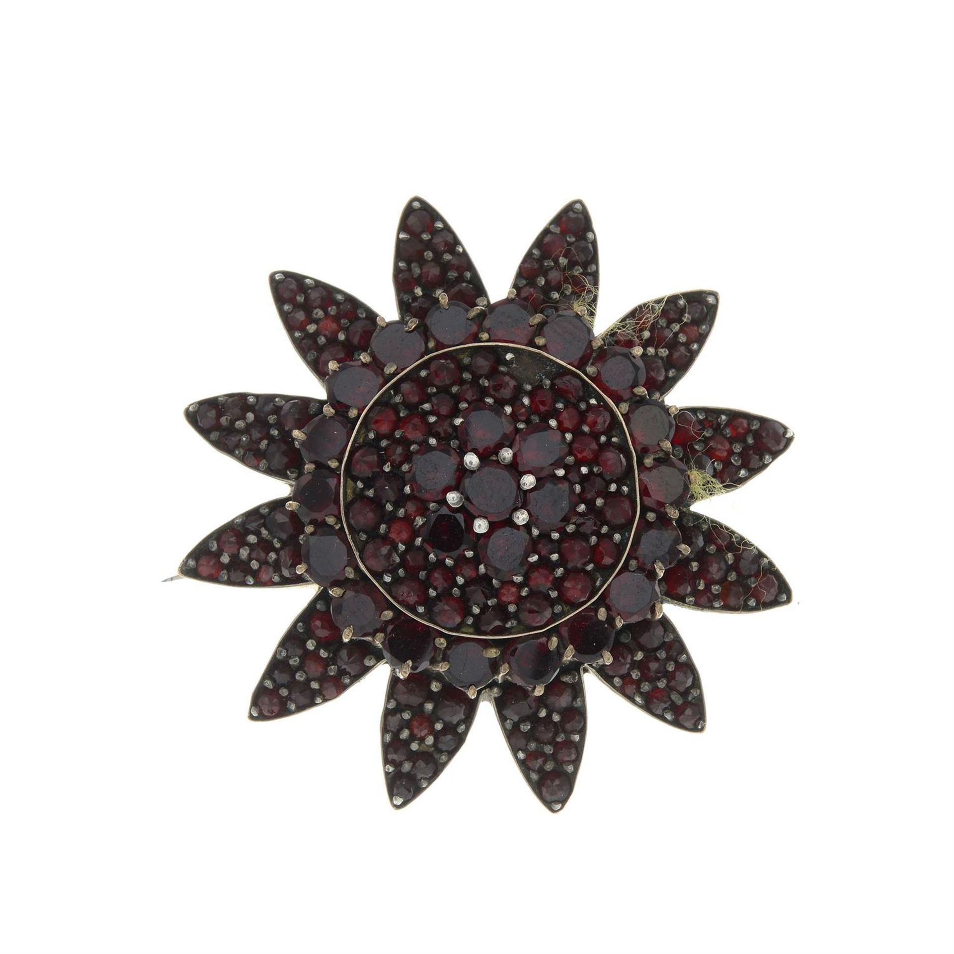 A late 19th century garnet floral brooch. AF.