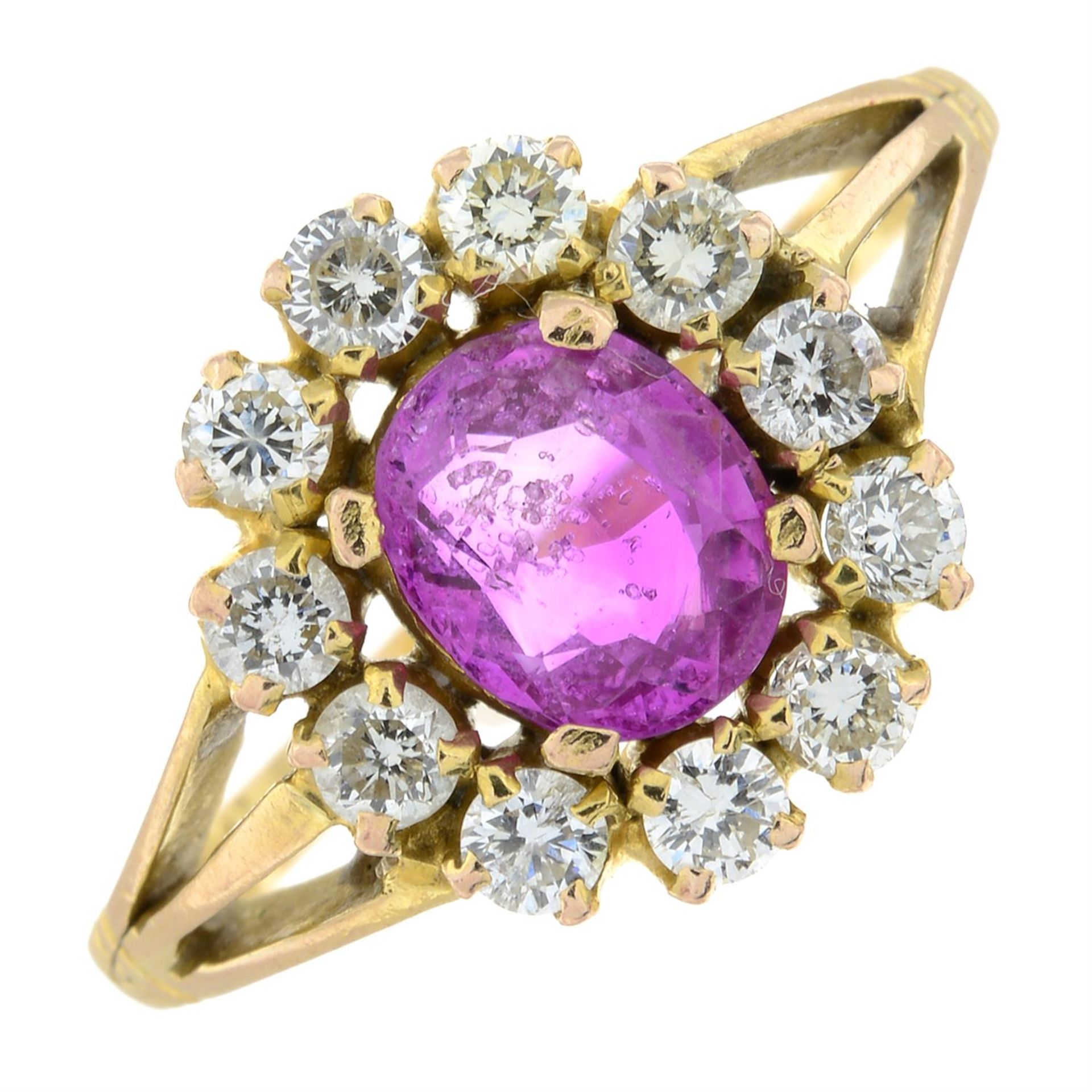 A pink sapphire and diamond cluster ring.