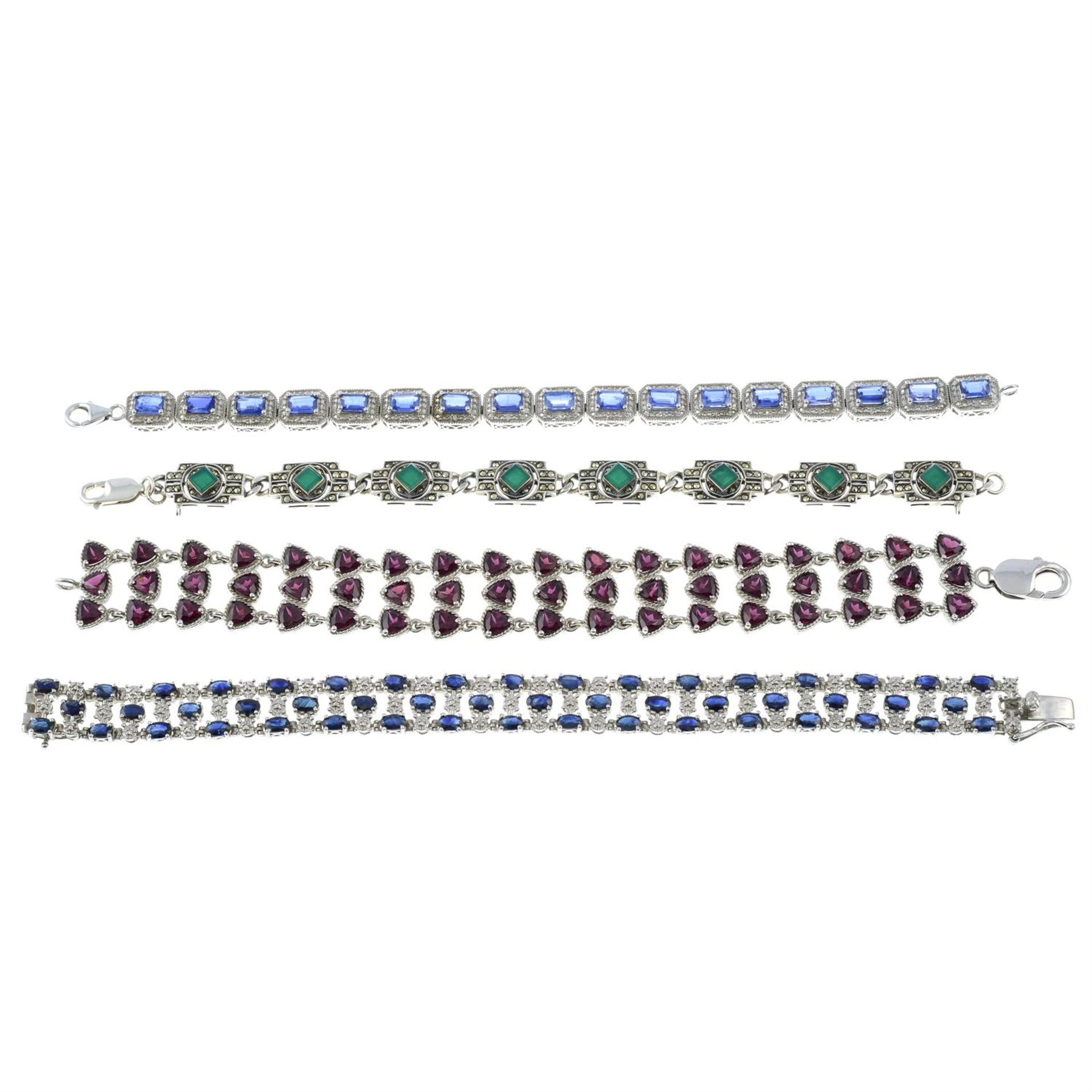 Four gem-set bracelets.