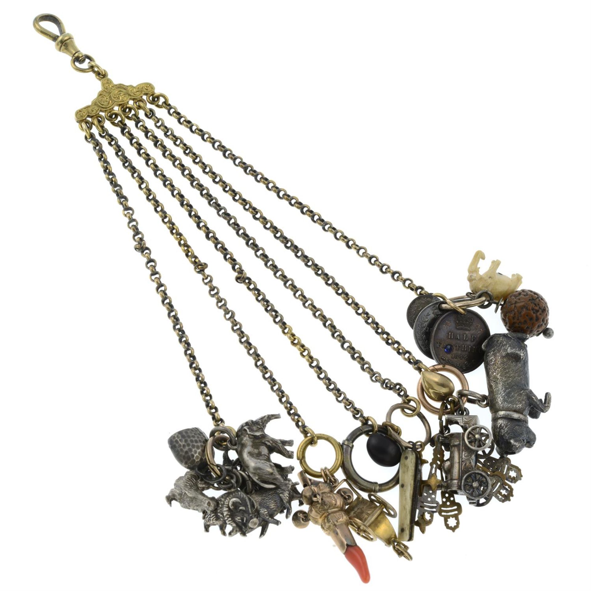 A late 19th century chatelaine, suspending various charms.