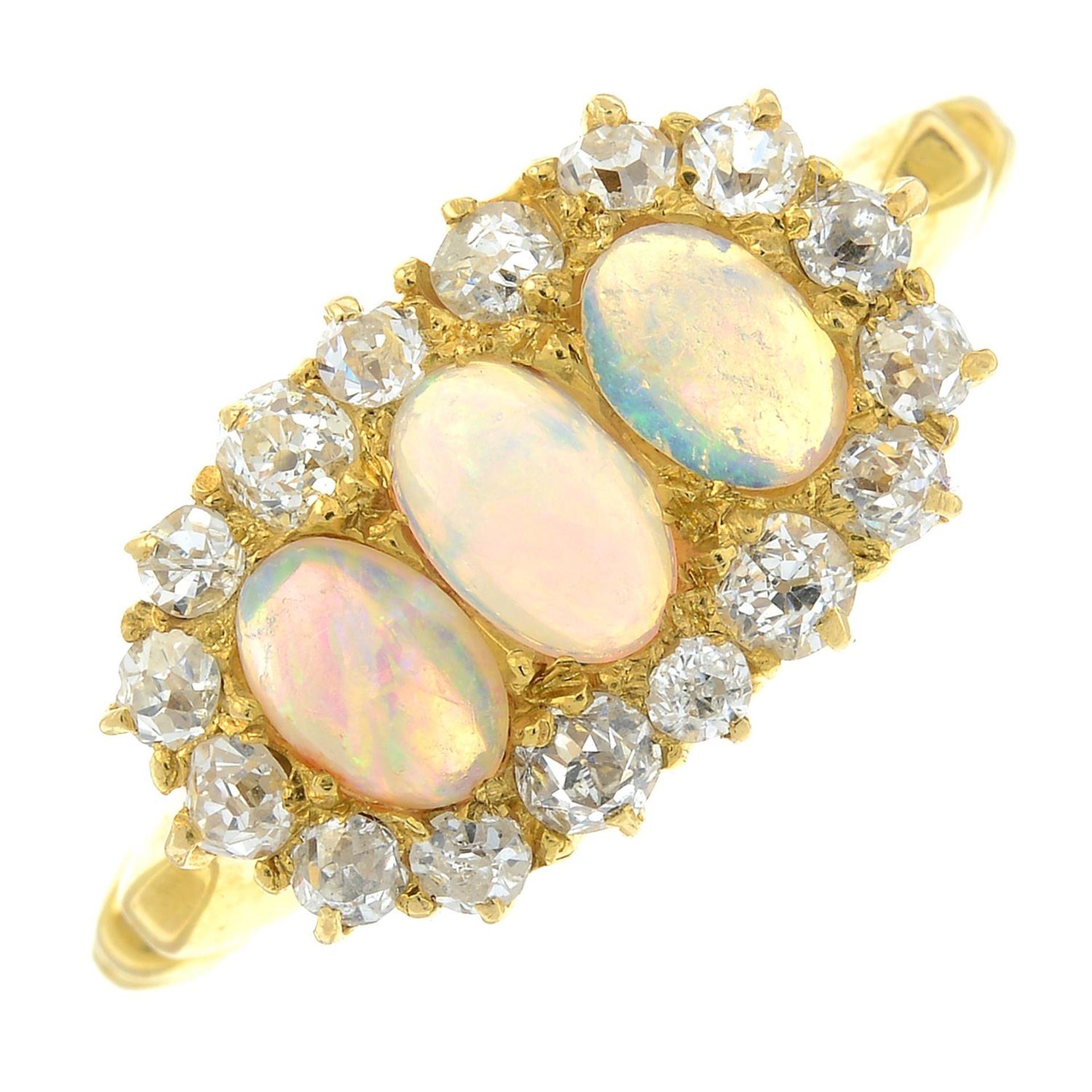 An early 20th century 18ct gold opal and old-cut diamond cluster dress ring.