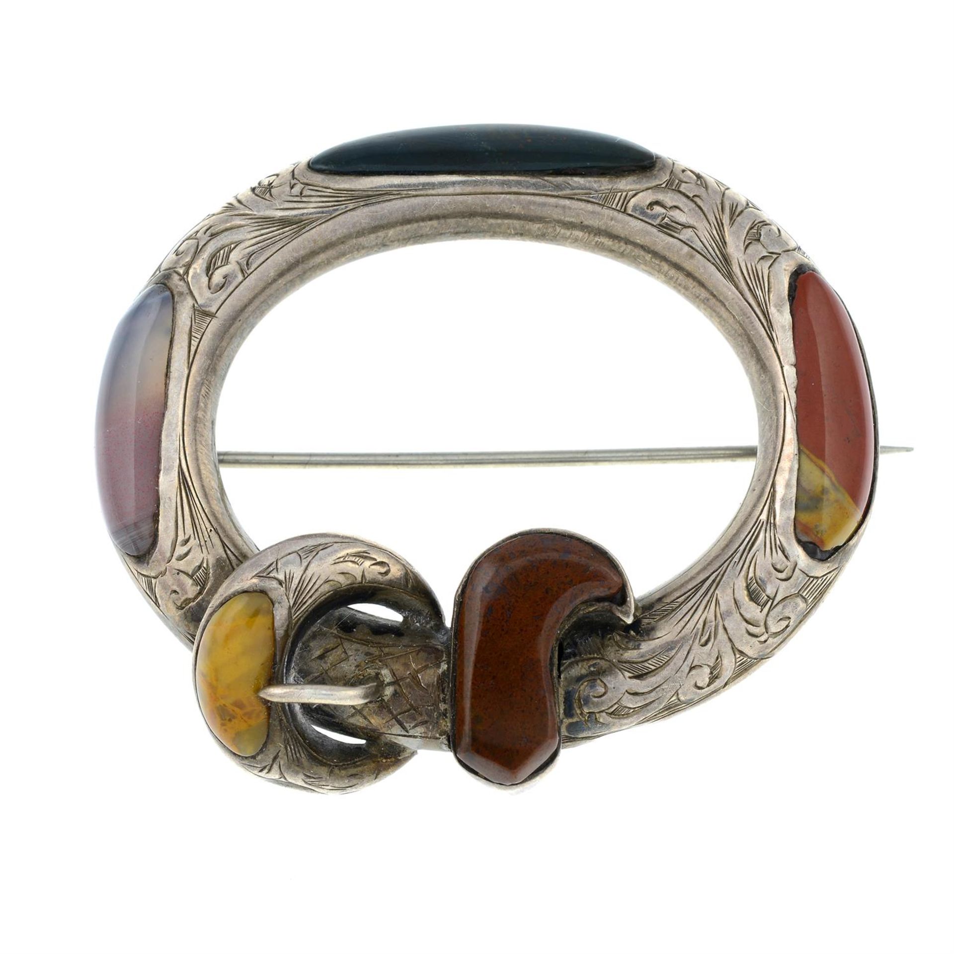 A 19th century Scottish 'Pebble' buckle brooch with engraved foliate decoration.