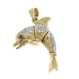 A 9ct gold cubic zirconia dolphin pendant with synthetic sapphire eyes.