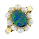 An opal doublet and seed pearl cluster ring.