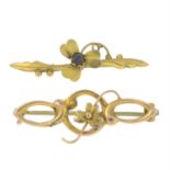 Two early 20th century 9ct gold floral brooches.