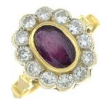 An 18ct gold ruby and diamond cluster ring.