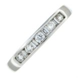 An 18ct gold vari-cut diamond half eternity ring.