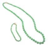 A graduated jade bead necklace and bracelet.