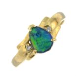 A boulder opal and diamond three stone ring.