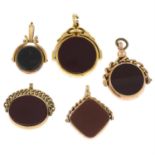 Five late 19th to early 20th century gold bloodstone and carnelian swivel fobs.