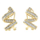 A pair of 9ct gold diamond earrings of zig-zag design.