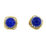 A pair of gold lapis lazuli stud earrings.