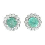 A pair of 18ct gold emerald and diamond cluster stud earrings.