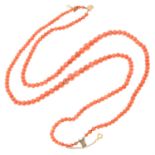 A graduated double row coral bead necklace, with clasp.