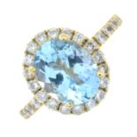 A blue topaz and brilliant-cut diamond cluster ring.