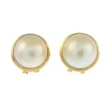 A pair of mabe pearl earrings.