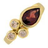 A garnet and cubic zirconia ring.