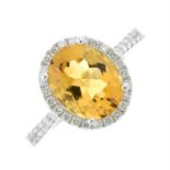 An 18ct gold citrine and diamond cluster ring.