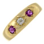 An early 20th century gold ruby and diamond three-stone ring.