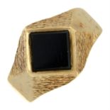 A 9ct gold onyx signet ring.