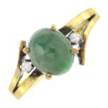 A jade and diamond three-stone ring.