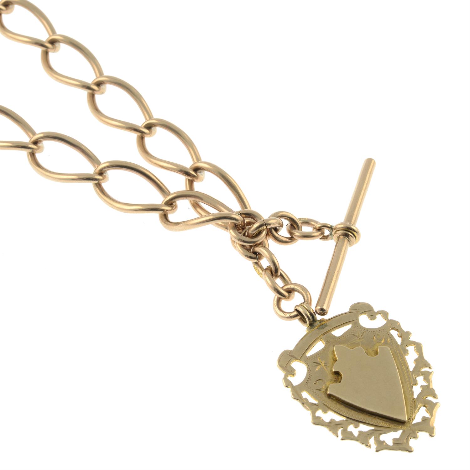 An early 20th century 9ct gold Albert, suspending a medallion fob.