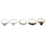 Five 9ct gold gem-set rings.