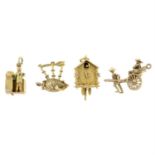 Eight 9ct gold charms.