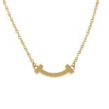 A 'Tiffany T Smile' pendant, on an integral chain, by Tiffany & Co.