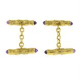 A pair of 1960s 18ct gold textured bamboo motif cufflinks, with amethyst cabochon terminals.