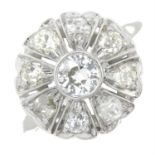 An old-cut diamond cluster ring.