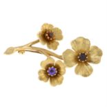 A 9ct gold gem-set floral brooch.