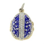 An enamel egg pendant, open to reveal an apple, with colourless paste accents.