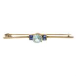 An early 20th century gold blue zircon and sapphire bar brooch.