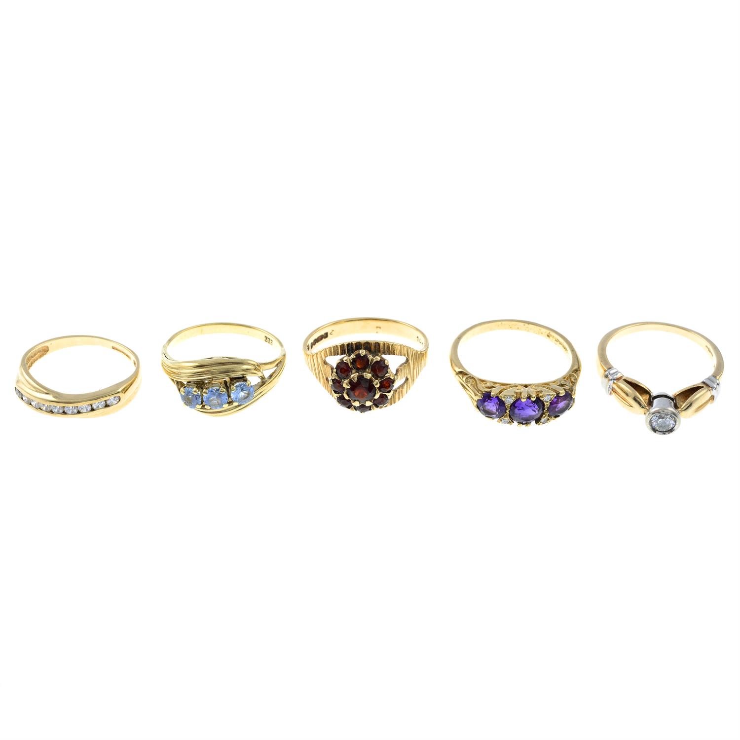 Five mostly 9ct gold gem-set rings.