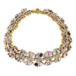 A 9ct gold multi-colour sapphire and diamond bracelet.