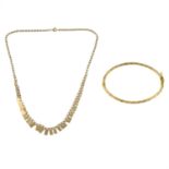 A 9ct gold fancy-link necklace and a 9ct gold bangle.