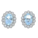 A pair of 18ct gold aquamarine and diamond cluster earrings.