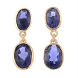 A pair of iolite drop earrings.