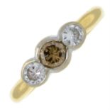 An 18ct gold circular-cut diamond and coloured diamond three-stone ring.