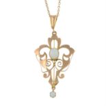 An early 20th century 9ct gold opal pendant, with trace-link chain.