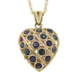 A 9ct gold sapphire and ruby pendant, suspended from a 9ct gold chain.