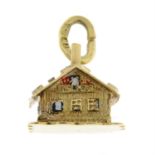 An enamel house charm.