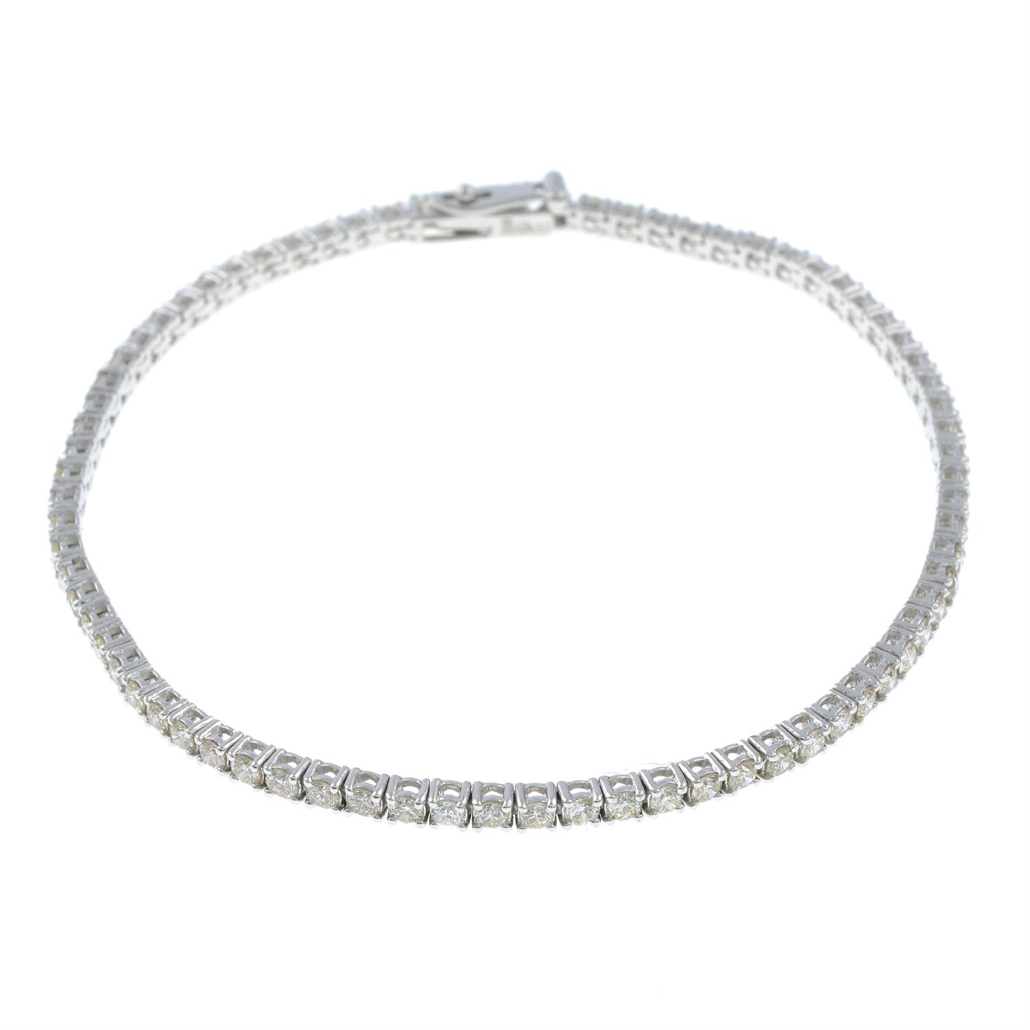 An 18ct gold brilliant-cut diamond line bracelet.